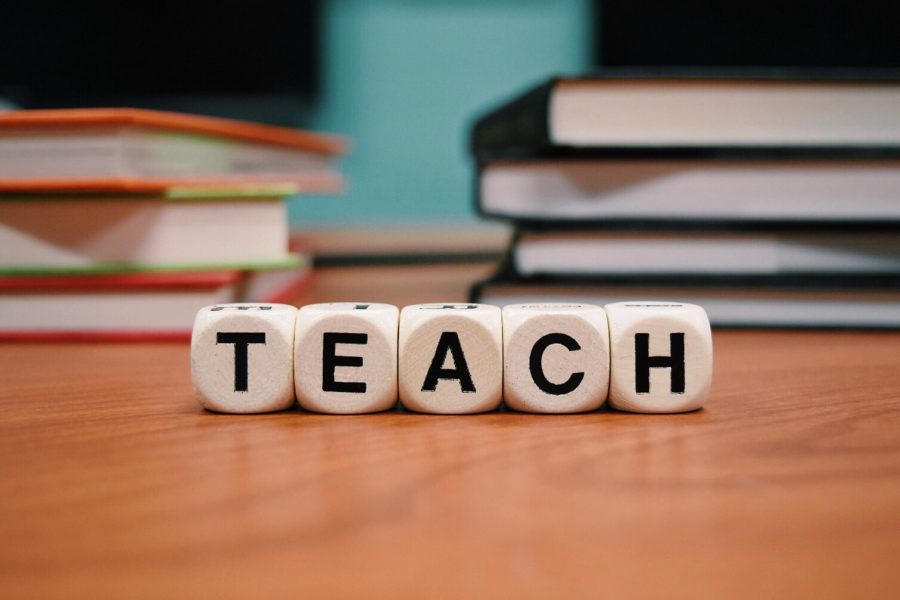 Letter cubes spelling TEACH